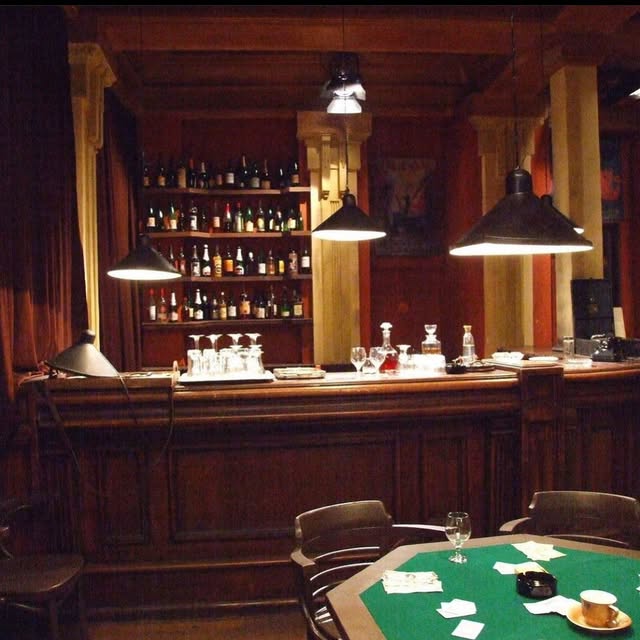Film interior with a wooden bar, props and a games table